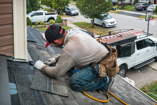 Professional Roofing technician working in Willimantic, CT